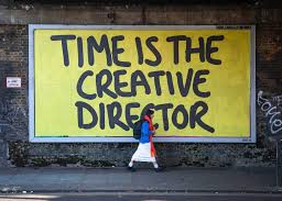Buildhollywood outdoor advertising — TIME IS THE CREATIVE DIRECTOR billboard on a London street wall